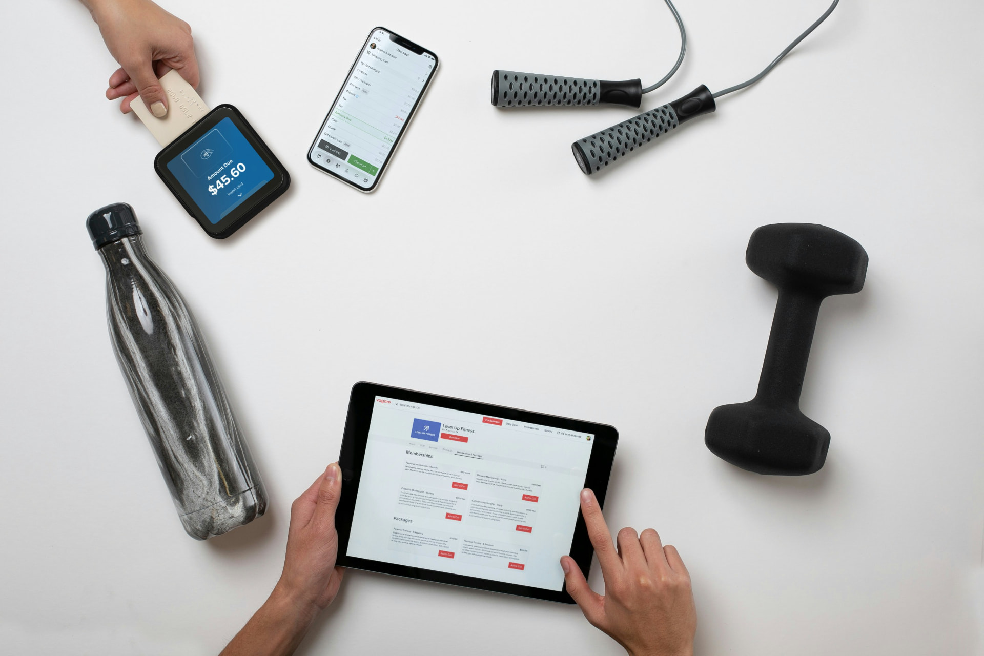 Studio owner taking a membership payment on a tablet